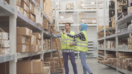 Warehouse workers communicate and carry out accounting scanner barcode