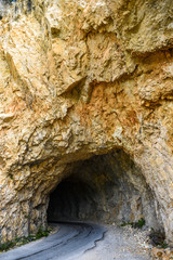Tunnel in the limestone rock in Montenegro.