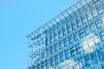 Detail of blue glass city corporate building.