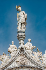Roman warrior as roof decoration of Basilica San Marco in Venice, Italy, summer time