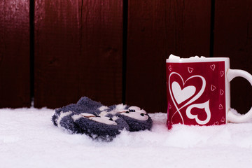 Cup of chocolate with marshmallows on wood wall