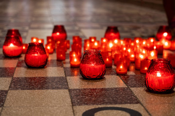 Obraz premium Candles on the floor in the church.
