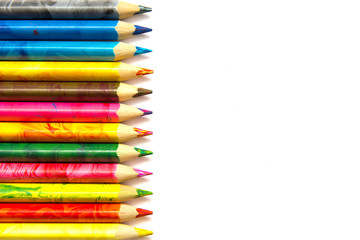 many color pencils on a white background copy space
