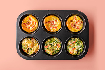 Healthy breakfast egg muffins with cheese, tomato and green vegetable, easy and healthy food concept