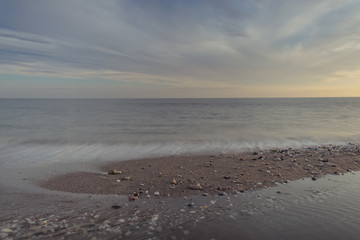 Nerja, Malaga, Andalusi, Spain - November 29, 2018: Long exposure of the sunset on the beach in village of Nerja, Spain