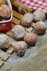 Sweet small donuts in the platter in the shape of a heart. . The fat Thursday of carnival. Slavic tradition. Seasonal and festive concept

