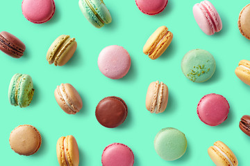 Colorful french macarons on blue background