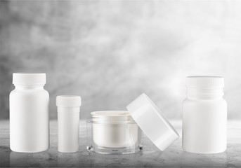 Cosmetic containers isolated on background