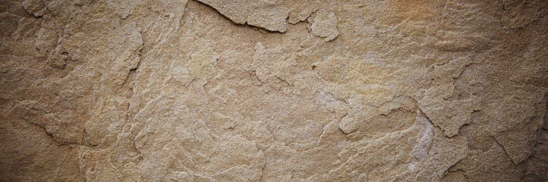 Textured stone sandstone surface. Close up image