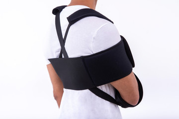 broken hand wearing an arm brace