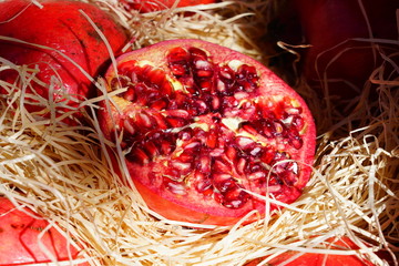 Crate of fresh red pomegranate fruit