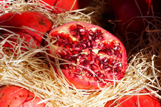 Crate of fresh red pomegranate fruit
