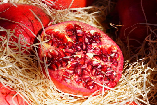 Crate of fresh red pomegranate fruit