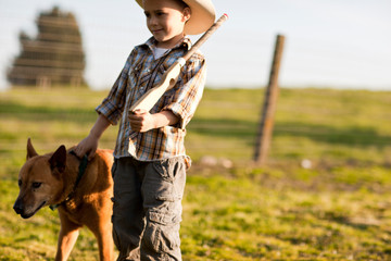 Boy playing cowboys and indians.