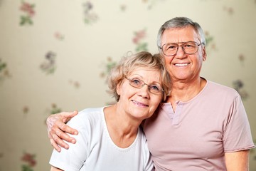 Portrait of happy senior couple smiling