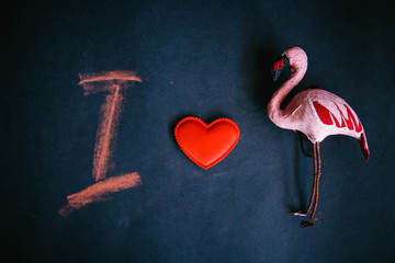 I love the Flamingo, the symbol of the heart of flamingos and the letter I on a dark background