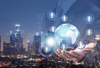 Cropped photo of businessman holding globe with digital icons