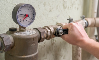 Plumber opens faucet and runs water through  aqueduct.