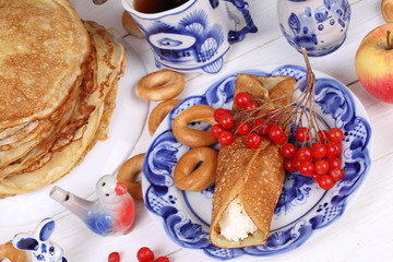 Still life with pancakes, apples, cottage cheese and viburnum. Pancake week
