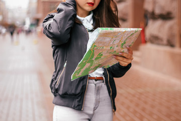 woman  with a map in the city