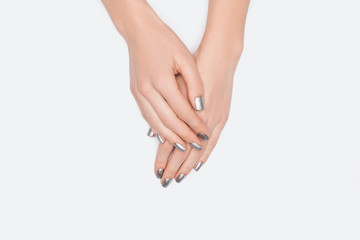 Fototapeta premium top view of female hands isolated on white