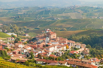 Fototapeta na wymiar Barolo village seen from above in autumn, surrounded by vineyards in autumn, Langhe region, Piedmont, Italy