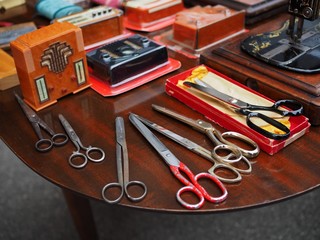 Flea market. Group of scissors.