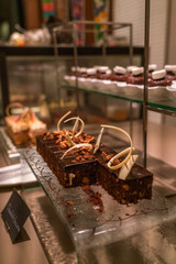 Vertical photo of Choco cheese cake in a row in bakery