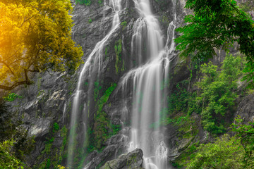 Fototapeta na wymiar Khlong Lan Waterfall, the beautiful waterfall in deep forest at Khlong Lan National Park ,Kamphaeng Phet, Thailand
