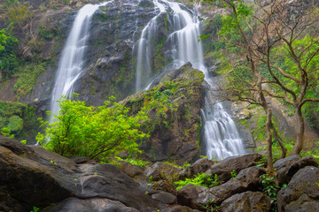 Fototapeta premium Khlong Lan Waterfall, the beautiful waterfall in deep forest at Khlong Lan National Park ,Kamphaeng Phet, Thailand,