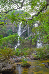 Fototapeta na wymiar Khlong Lan Waterfall, the beautiful waterfall in deep forest at Khlong Lan National Park ,Kamphaeng Phet, Thailand