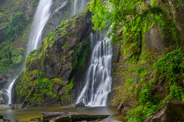 Fototapeta na wymiar Khlong Lan Waterfall, the beautiful waterfall in deep forest at Khlong Lan National Park ,Kamphaeng Phet, Thailand,