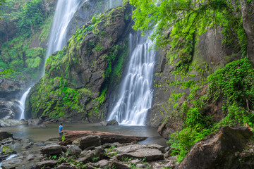Fototapeta premium Khlong Lan Waterfall, the beautiful waterfall in deep forest at Khlong Lan National Park ,Kamphaeng Phet, Thailand,
