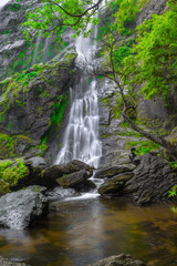 Fototapeta premium Khlong Lan Waterfall, the beautiful waterfall in deep forest at Khlong Lan National Park ,Kamphaeng Phet, Thailand