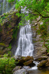Naklejka na ściany i meble Khlong Lan Waterfall, the beautiful waterfall in deep forest at Khlong Lan National Park ,Kamphaeng Phet, Thailand,