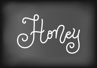 Modern calligraphy lettering of Honey in white on blackboard background stylized as chalk lettering for decoration, poster, banner, sticker, packaging, logo, shop, cafe, restaurant, bar, recipe book