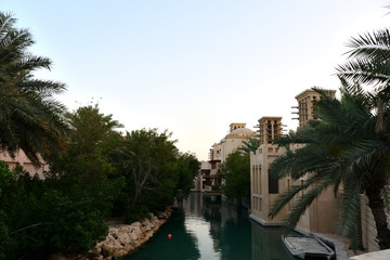 View of the artificial channel in the Arab city at sunset