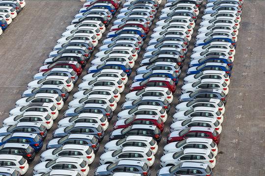 New cars in rows stored at port Rashid in Dubai, UAE
