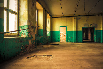 Dark interior inside abandoned old factory building 