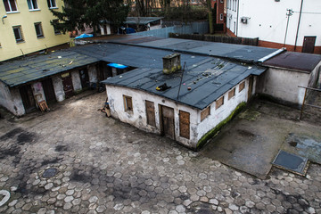 Fototapeta premium Zyrardow, Poland. Views on backyard in one of block of flats in historic part of industrial town
