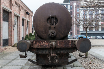 Old black lokomotive in Żyrardow (Poland) covered with rust.
