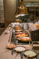 Vertical photo of delicious buffet in the luxury hotel