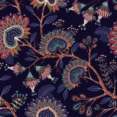 Colorful wallpaper with paisley and decorative plants. Vector Indonesian floral batik. Vector decorative indian background. Stylized flowers and shapes on the dark backdrop. Design for fabric, carpet