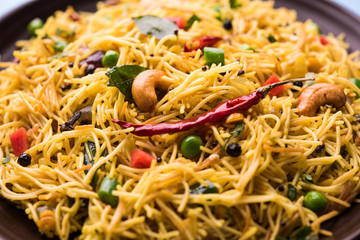 Spicy semiya uppma or upma served in plate. selective focus