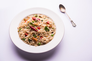 Semiya Upma or Vermicelli Uppuma or uppittu is a popular breakfast menu from south India. served in a bowl. selective focus