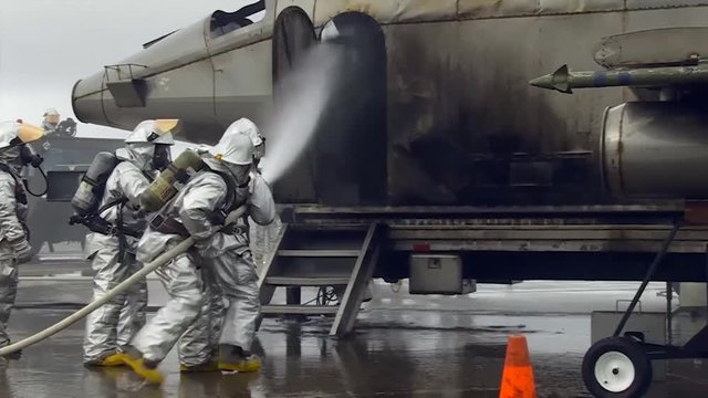 Firefighters during aircraft firefighting training 
