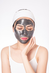 beautiful woman masking her face on white background
