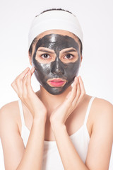 beautiful woman masking her face on white background