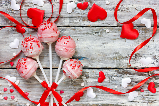 Red Velvet Cake Pops Covered In White Chocolate Decorated With Red And Pink Sugar Sprinkles, Sweet Treats For Valentine Day