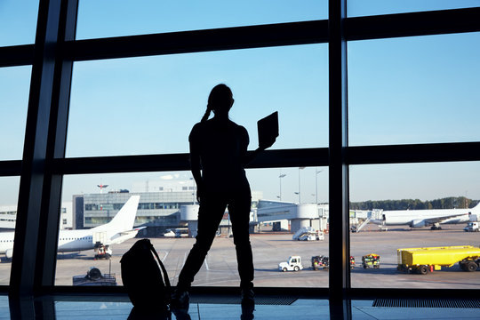 silhouette of a businesswoman at the airport